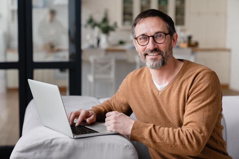 Man sitting at a laptop